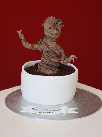 Baby Groot cake - peanut butter and chocolate fudge cake with baby Groot made from modelling paste.  #IamGroot #GuardiansOfTheGalaxy