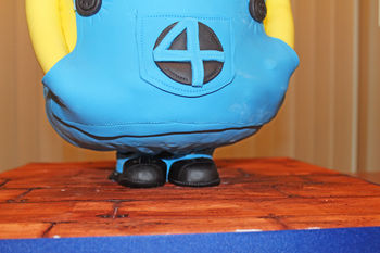Bottom of Minion cake showing the feet and the Minion standing.