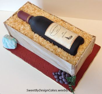 Cake measures 6" x 14". Sugar paste wine bottle, cheese and grapes.